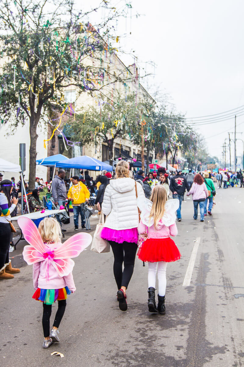 Walking along St, Charles Avenue in New Orleans during Mardi Gras