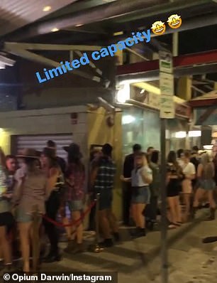Clubgoers are seen queuing outside Opium nightclub in Darwin (pictured)