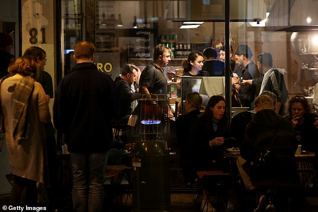 A busy Cairo restaurant in Sydney is seen on Friday night (pictured) as enthusiastic diners flocked out in the city