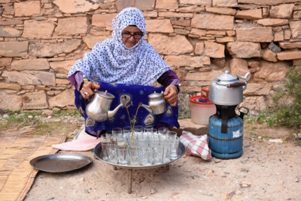 A woman serving mint tea in Agadir, Morocco
