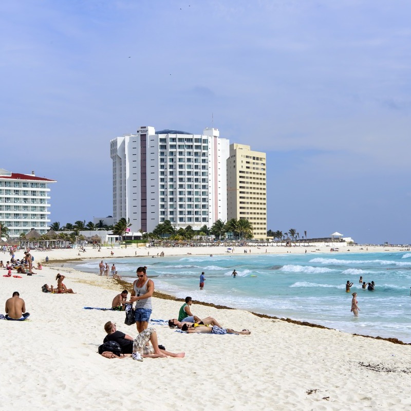 Tourists Sunbathing In Cancun Beach, Quintana Roo